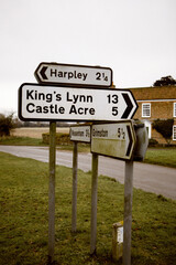 Weathered directional road signs in Great Massingham, England
