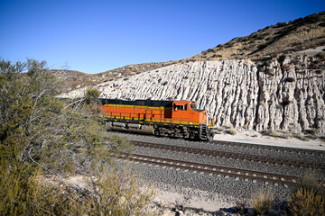 Powerful locomotive engine emerging on railroad tracks