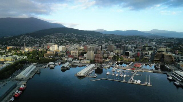 Aerial Hobart Harbour Waterfront and town day slow flying left