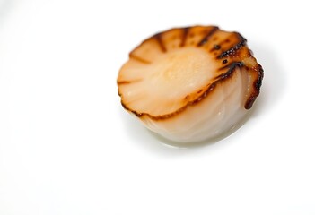 close up of a piece of food on a white surface
