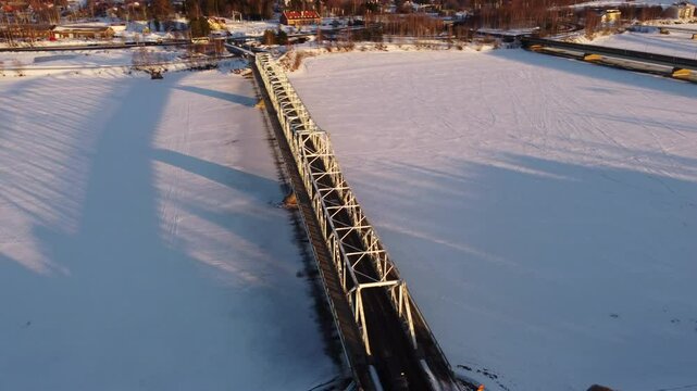Aerial View Over Bridge During Winter In Tornio City, Finland - Drone Shot