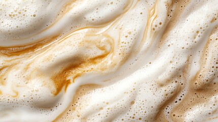 Creamy coffee foam with rich caramel swirls.