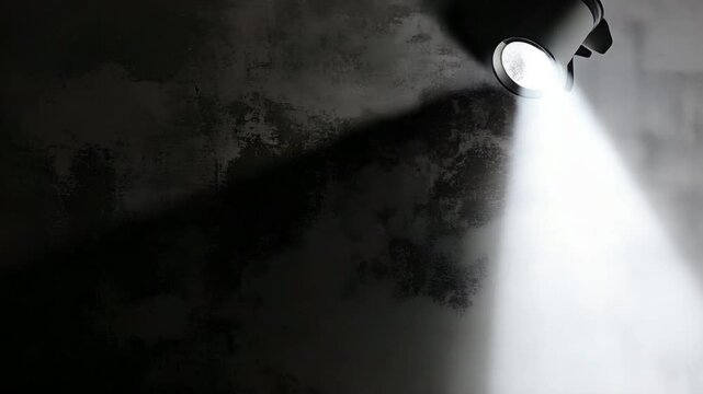 Spotlight Illuminating Textured Wall with Mysterious Atmosphere