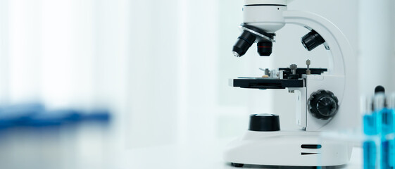 Scientist analyze biochemical samples in advanced scientific laboratory. Medical professional use microscope look microbiological developmental of viral. Biotechnology research in science lab.