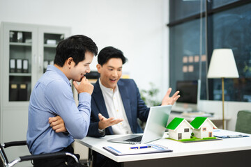 Professional team collaboration in modern office, discussing real estate model and signing contract, concept of startup