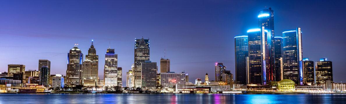 Detroit Michigan downtown city skyline over river at night panorama