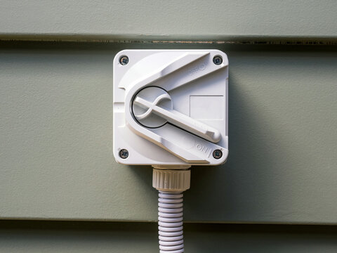 Outdoor Electrical Isolator Switch - Weatherproof Power Disconnect Mounted on Wall