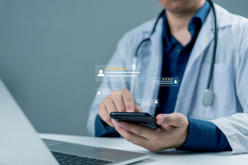 Fototapeta na wymiar Doctor using mobile phone to check patient feedback and online review ratings, representing healthcare digital service, telemedicine, trust, and modern medical technology.