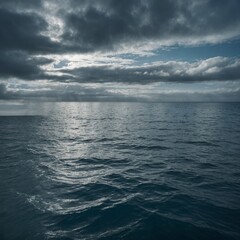 Obraz premium Storm clouds gather over the vast blue sea, a dramatic seascape under the summer sky
