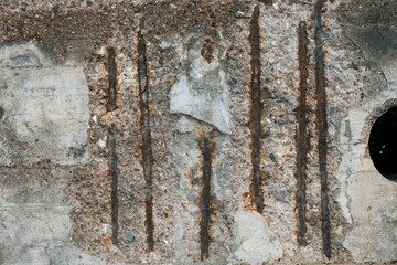 Broken concrete revealing reinforcement steel – urban decay detail