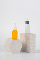 Plastic yellow tube for cream or lotion. Skin care or sunscreen cosmetic with stylish props on white background.