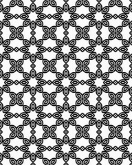 Detailed geometric pattern composed of repeated floral shapes in black and white, showcasing symmetry and artistic design