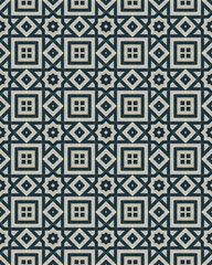 A detailed arrangement of squares and diamond shapes forms an elegant geometric pattern, showcasing contrast between dark blue and beige