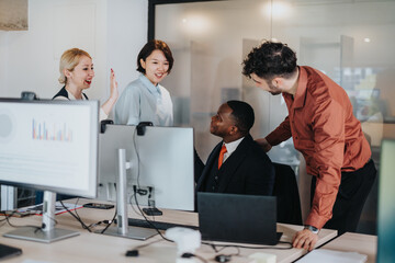 A group of business associates collaborating on a project in a contemporary office, engaging in brainstorming and teamwork while seated around desks with computers and documents.