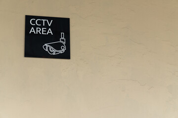 cctv area signage sign symbol on plain aged wall home security privacy surveillance