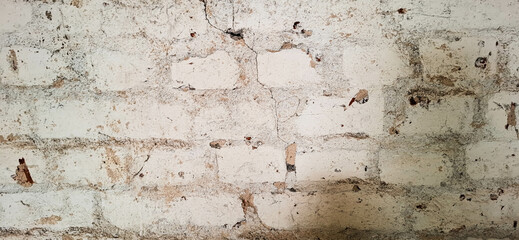 The texture of the brick wall of an old crumbling building.