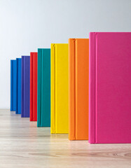 Fototapeta premium A row of colorful notebooks with blank covers invites new ideas and stories for the upcoming school year.