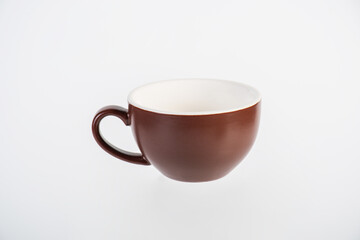 Coffee in a brown cup, coffee in a brown mug, coffee in a glass, cup on white background