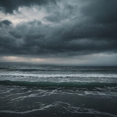 Obraz premium Dark storm clouds gather over the stormy sea, creating a dramatic seascape with powerful waves under a cloudy sky
