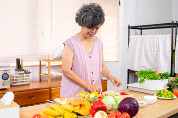 Senior woman lifestyle cooking preparing healthy food, elderly retirement joyful living at home...