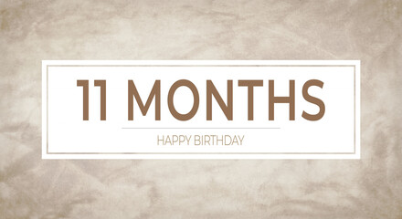 Obraz premium Beige textured background with bold “11 MONTHS” typography framed in white and “HAPPY BIRTHDAY” caption—perfect for monthly birthday announcements, celebration cards and party designs.