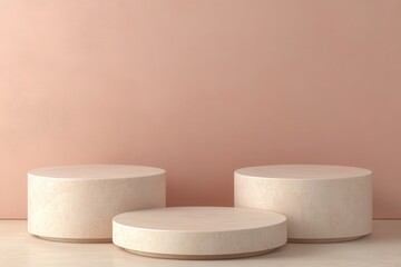 Three pale cylindrical platforms against a muted pink wall