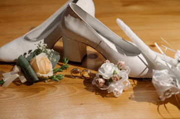 Wedding accessories. Shoes, wedding rings, bouquets. Bride's morning, preparation