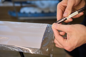 Applying a Protective Film on the Surface of Your Car for Enhanced Durability and Shine