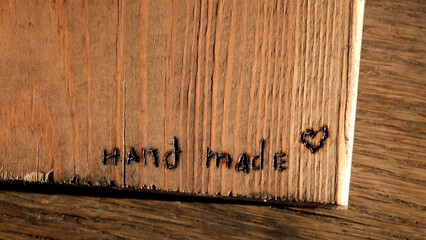 Burned out the inscription Hand made. Woodburning or pyrography. Drawing on a wooden plank with pyrograph. Wood burning creative hobby. Art class workshop. Creative activity. High quality 4k footage.