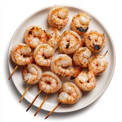 A plate of grilled shrimp skewers, isolated on a white background
