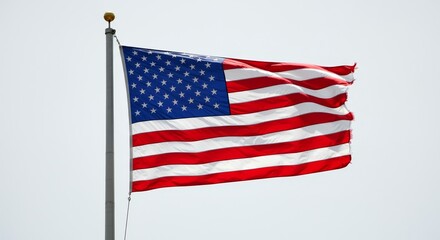 Fototapeta premium Photo of American Flag Waving in the Wind