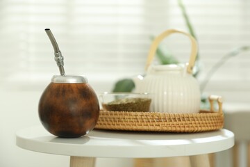 Traditional yerba mate tea on white table indoors