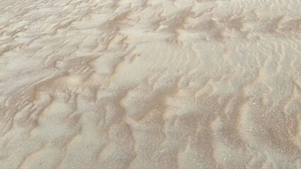 Close-up View of Fine Beach Sand Textures Shaped by Natural Elements Capturing the Essence of Organic Design and Environmental Storytelling
