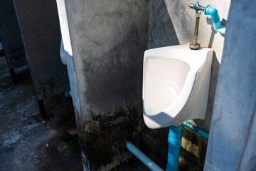 Men white urinals, Close up row of outdoor urinals men public toilet. Urinal concept.