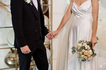 Wedding day. Bride and groom putting wedding rings on each other during the wedding ceremony. Close-up of hands