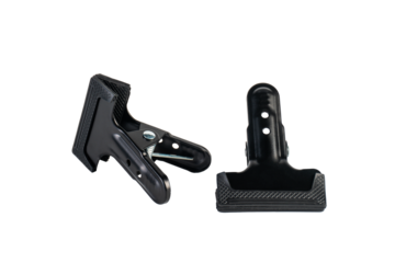 Black plastic spring clamp isolated on transparent background.