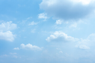 Serene Summer Sky Fluffy White Clouds Drifting Across a Bright Blue Heaven