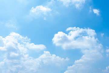 Serene Summer Sky Blue Sky with Fluffy White Clouds Background