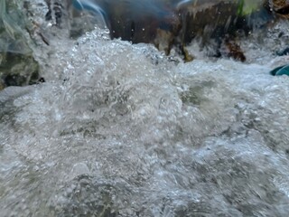 water flowing over rocks in a small river
