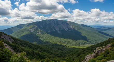 Fototapeta premium Mountain landscape showcasing natural beauty and serenity, with lush greenery and cloudy sky
