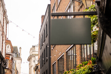 An empty shop sign with space for text copy or logo in urban European British London setting