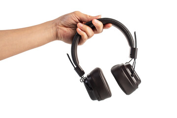 HeadPhones in hand, Headphones isolate on transparent. Wireless headphones in brown.