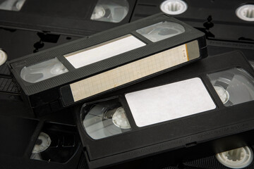 Close-up view of retro VHS cassettes with blank labels