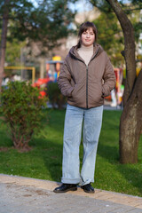 portrait of a teenage girl in a spring park