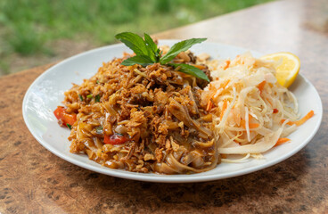 Pad thai or phad tha asian noodles closeup. Chinese rice pasta, phat thai with meat, noodles