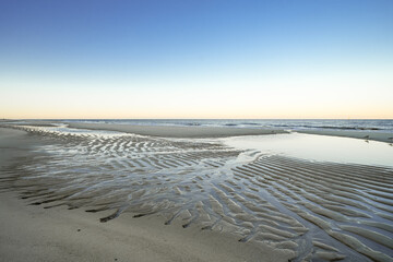 View of the beach on the Frisian island of Sylt near Westerland. Nature on the North Sea.

