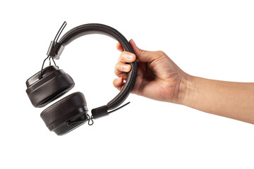 HeadPhones in hand, Headphones isolate on transparent. Wireless headphones in brown.