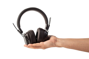 HeadPhones in hand, Headphones isolate on transparent. Wireless headphones in brown.