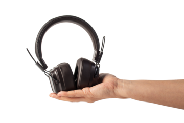 HeadPhones in hand, Headphones isolate on transparent. Wireless headphones in brown.