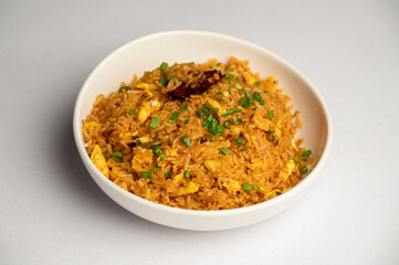 Chicken & Seafood Fried Rice — A flavourful Pan-Asian dish made with stir-fried rice, tender chicken, and assorted seafood, served in a white bowl on a white background.